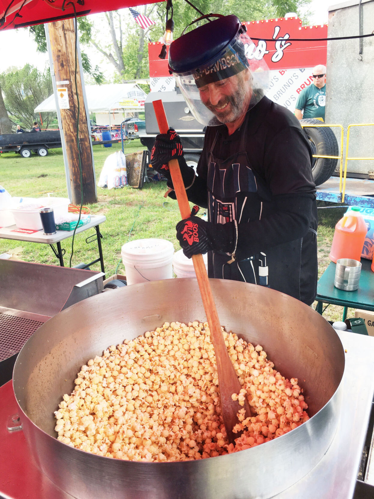 Kettle corn maker Brian Luccas uses a giant spoon at Lions Fun Fest in Waterford